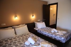 Postel nebo postele na pokoji v ubytování Klepsidra rooms