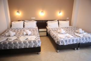 Postel nebo postele na pokoji v ubytování Klepsidra rooms