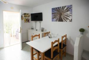 A television and/or entertainment centre at Vera Playa Fuentemar