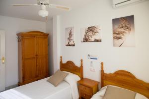 A bed or beds in a room at Vera Playa Fuentemar