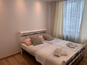 Postel nebo postele na pokoji v ubytování Sweet apartament