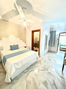 Postel nebo postele na pokoji v ubytování Hotel Sand Bay