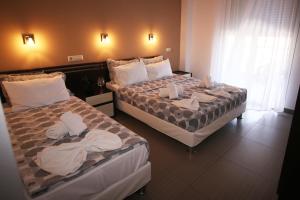 Postel nebo postele na pokoji v ubytování Klepsidra rooms