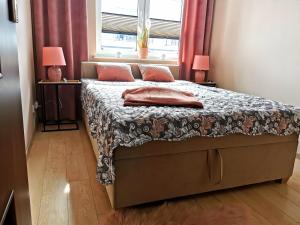 Posteľ alebo postele v izbe v ubytovaní Markowe Apartamenty Złoty Park
