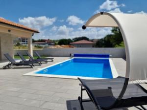 Bazén v ubytování Villa Oasis - pool villa in heart of Istria nebo v jeho okolí