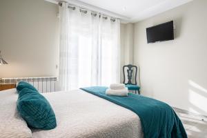 Cama o camas de una habitación en Pension ARCA