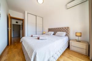 Voodi või voodid majutusasutuse Luxury apartment near beach toas