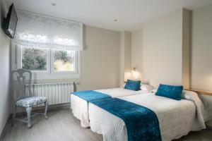 Cama o camas de una habitación en Pension ARCA