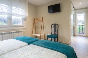 Cama o camas de una habitación en Pension ARCA