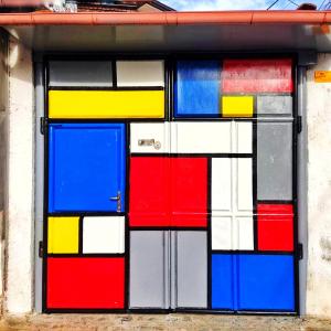 a colorful glass window on the side of a building at Private room historic center Elbasan in Elbasan