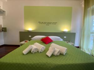 Postel nebo postele na pokoji v ubytování Al Teatro Greco