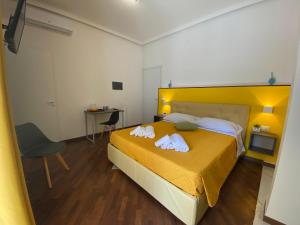 Postel nebo postele na pokoji v ubytování Al Teatro Greco