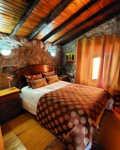 מיטה או מיטות בחדר ב-Casa Matreiro