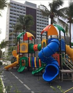 a row of playground equipment in a parking lot at Salinas Premium Resort cobertura vista mar in Salinópolis