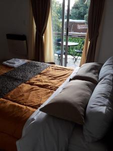 A bed or beds in a room at Departamento Anita centro