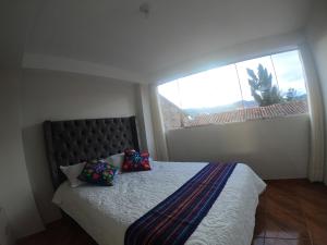 Postel nebo postele na pokoji v ubytování Residencial Chávez Concha / Cusco