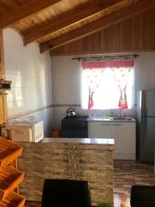 A kitchen or kitchenette at Cabañas Terra Nova Colbun Machicura