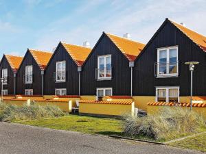 a row of houses with orange roofs at 6 person holiday home in Skagen-By Traum in Skagen
