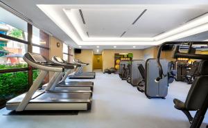 a gym with rows of treadmills at Paradox Singapore Merchant Court at Clarke Quay in Singapore