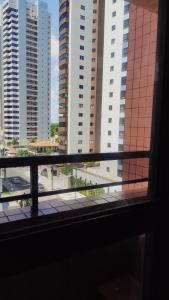a view from a window of a city with tall buildings at Apto imperial Cabo branco in João Pessoa