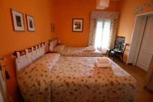Postel nebo postele na pokoji v ubytování Corte Posta B&B - parcheggio e bagno in camera