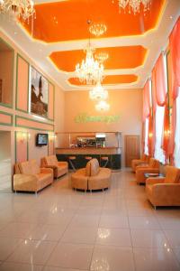 a lobby with orange furniture and a salon at Pyatigorsk Hotel in Pyatigorsk