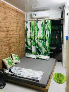 a bed in an rv with a curtain at Chicken's house- Đường Lâm Homestay in Hanoi