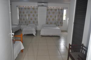 
Cama ou camas em um quarto em Hotel Cataratas
