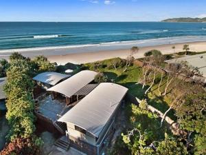 an overhead view of a building next to a beach at Fuller Holidays - Belongil Beachfront Pavilion, 18 Childe St in Byron Bay