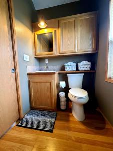 a small bathroom with a toilet and a sink at The Bogi Bear Inn in Forks