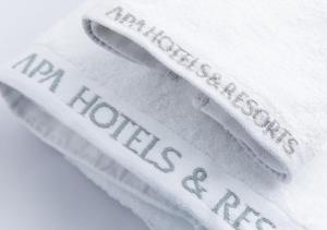 three white towels with the words new houstonacers at APA Hotel Hakata Higashihieekimae in Fukuoka