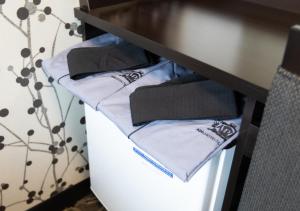 a drawer with three folded towels on a table at APA Hotel Hakata Higashihieekimae in Fukuoka
