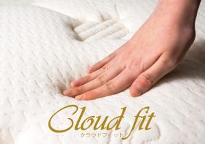a picture of a hand on a white mattress at APA Hotel Hakata Higashihieekimae in Fukuoka