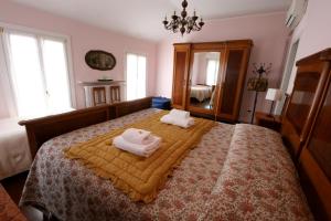 Postel nebo postele na pokoji v ubytování Corte Posta B&B - parcheggio e bagno in camera