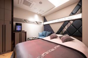 Postel nebo postele na pokoji v ubytování HOTEL K-NEXT