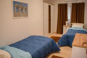 Postel nebo postele na pokoji v ubytování Spacious 3 bedroom apartment in Marsascala