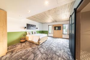 Postel nebo postele na pokoji v ubytování De BrauHotel + 37 fotografií