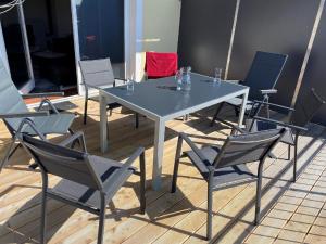 a white table and chairs in a room at Haus Glücksmoment in Sankt Englmar