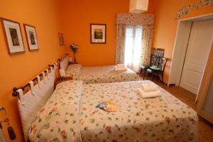 Postel nebo postele na pokoji v ubytování Corte Posta B&B - parcheggio e bagno in camera