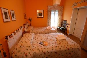 Postel nebo postele na pokoji v ubytování Corte Posta B&B - parcheggio e bagno in camera