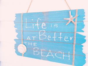 a sign that reads life is at better the beach at Mobile Home FantaSea in Novi Vinodolski