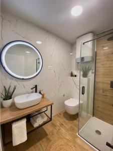 a bathroom with a sink and a mirror at Apartment City Walls in Old Town of Rovinj in Rovinj +34 photos