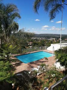 a swimming pool on top of a house at Palm View Guest House in Pretoria