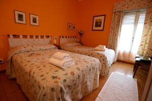 Postel nebo postele na pokoji v ubytování Corte Posta B&B - parcheggio e bagno in camera