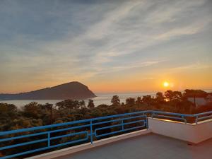a view of the sunset from the balcony of a house at Gaby's Villa in Koinyra