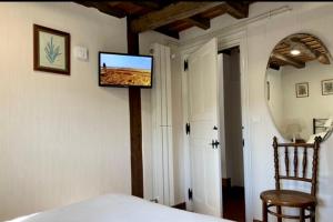 Telewizja i/lub zestaw kina domowego w obiekcie La Casita de Cuestallano