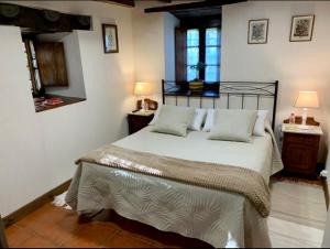 Łóżko lub łóżka w pokoju w obiekcie La Casita de Cuestallano