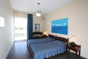 Кровать или кровати в номере Ballos Apartments +12 фотографий