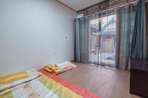 Postel nebo postele na pokoji v ubytování Aega Hanok Guesthouse