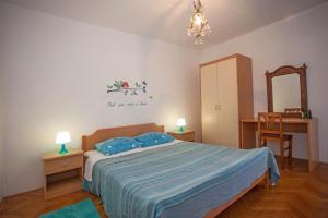 Posteľ alebo postele v izbe v ubytovaní Apartments and Room Agata